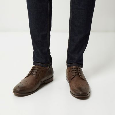 Dark brown wingtip formal shoes